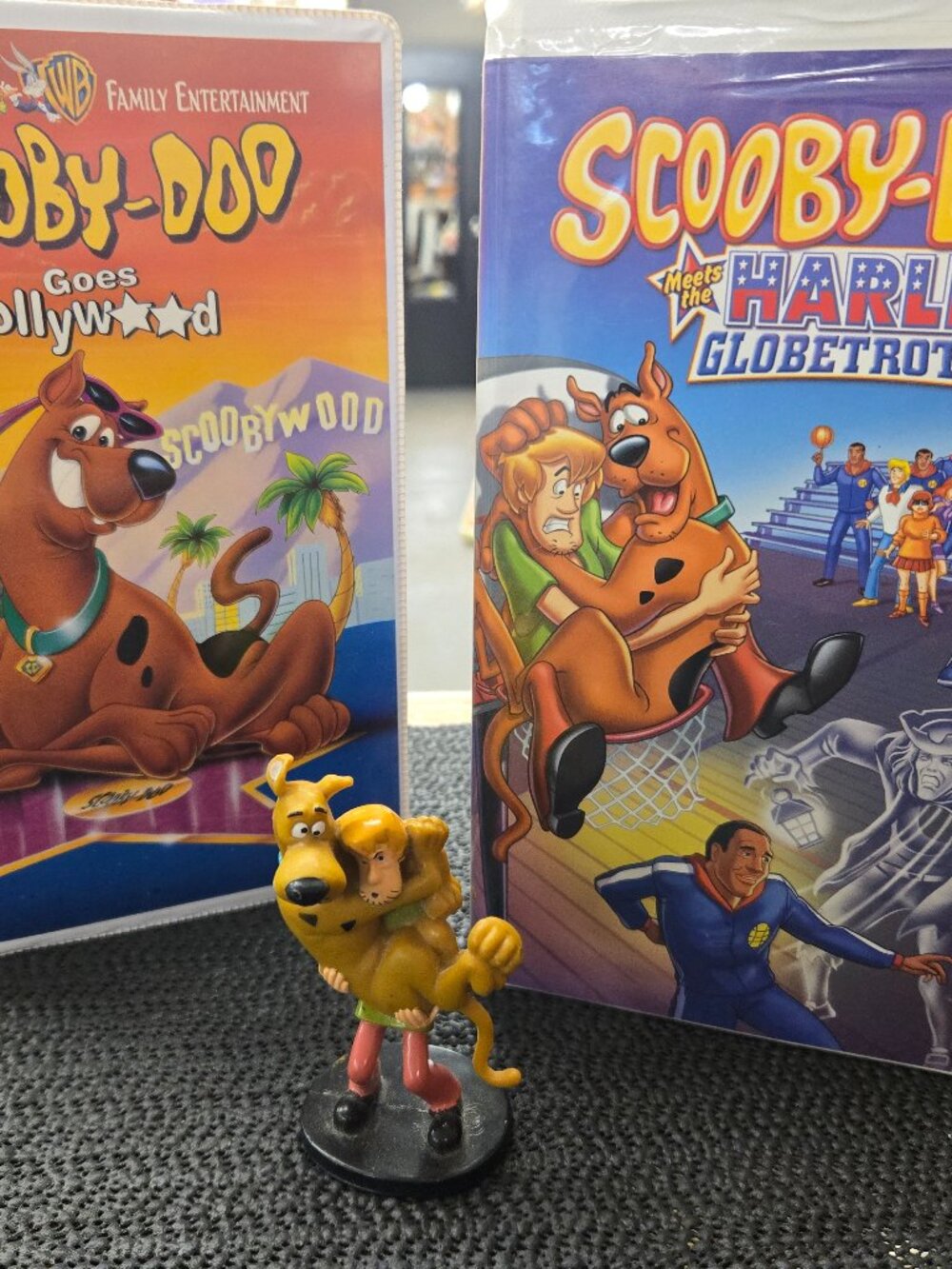 Pair of Scooby-Doo movies VHS with collectible figure